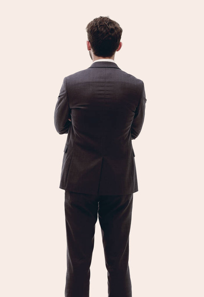 rear view, full-length of a businessman standing and looking for - Фото, зображення