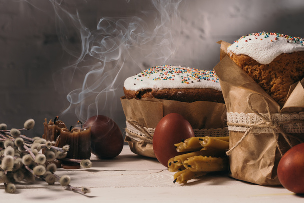 easter bread, painted eggs and catkins on table - Fotografie, Obrázek