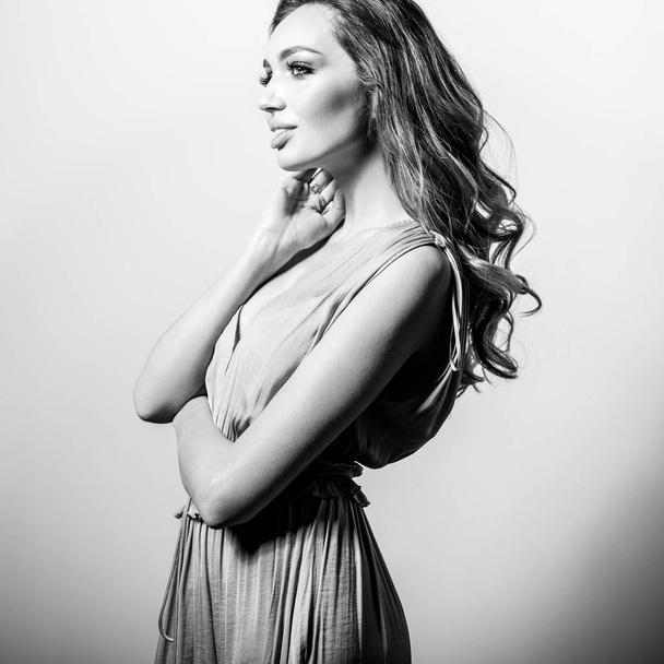 Young beautifull woman in silk dress black-white studio portrait. - Fotografie, Obrázek