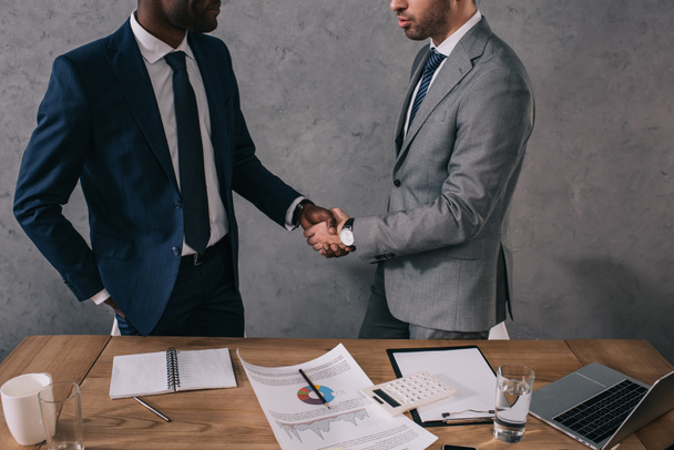 Cropped view of two businessmen shaking hands of each other  - Photo, Image