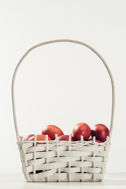 traditional painted chicken eggs in basket on grey, easter concept - Photo, Image