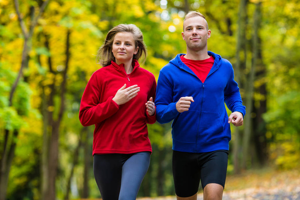 Healthy lifestyle - woman and man running - Fotografie, Obrázek