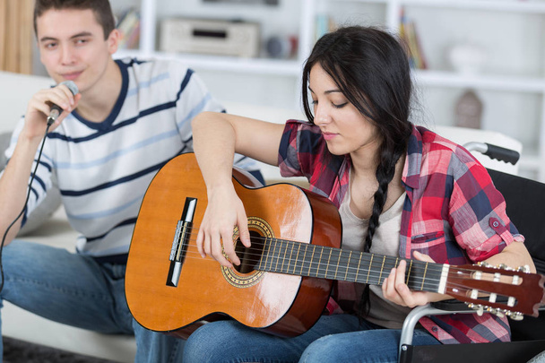 friends playing guitar and two - Foto, imagen