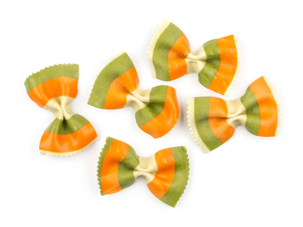Farfalle pasta with green spinach and orange carrot isolated on white background top view five raw classic traditional Italia - Fotoğraf, Görsel