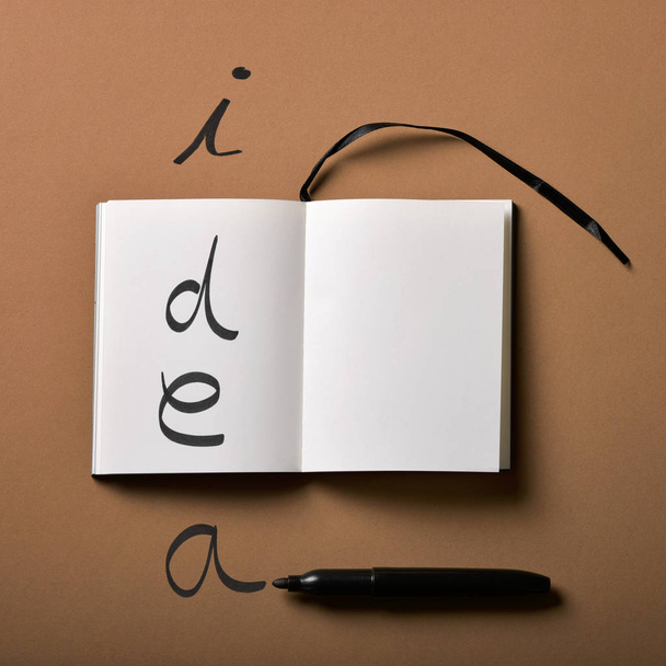 bloco de notas e palavra ideia escrita com uma caneta marcador
 - Foto, Imagem