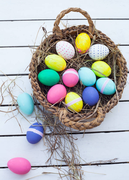 Colorful easter eggs in basket  - Valokuva, kuva