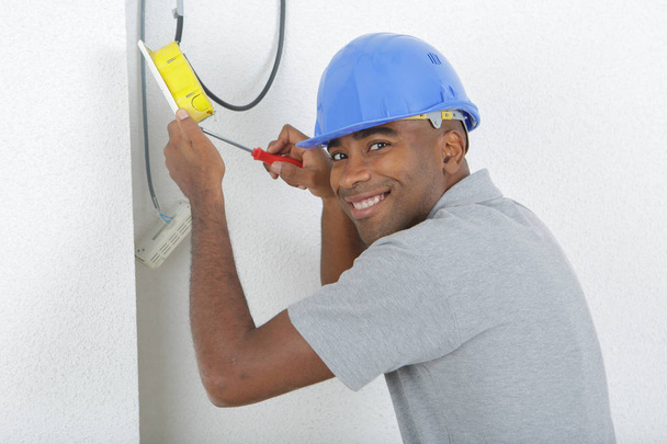 Male electrician working and electrician - Fotoğraf, Görsel