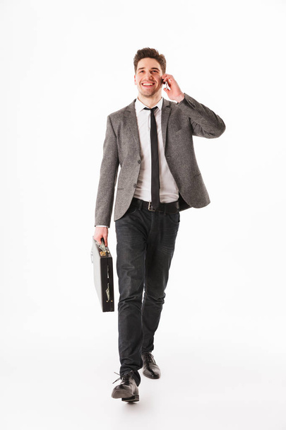 Full length portrait of a cheerful young businessman - Foto, Imagem
