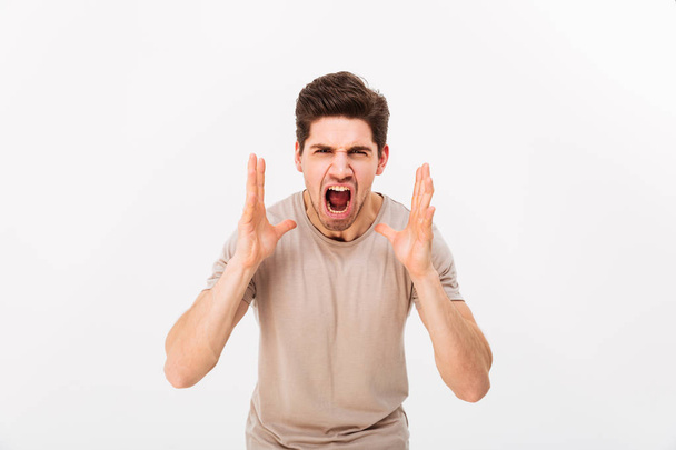 Photo of aggressive or irritated man screaming on camera while l - Foto, Bild