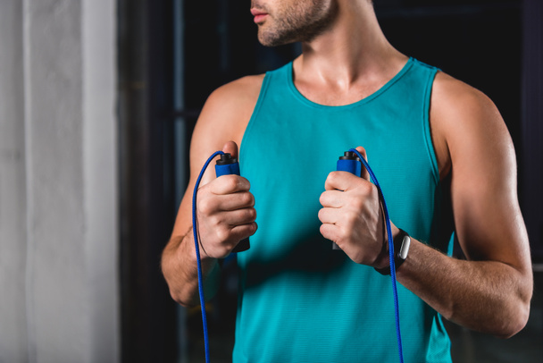 cropped view of sportsman holding jump rope - Foto, immagini