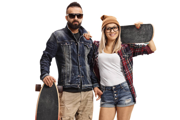 Male skater with a longboard and a female skater with a skateboard isolated on white background - Foto, immagini