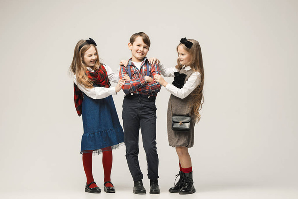 Cute stylish children on white studio background - Foto, Bild