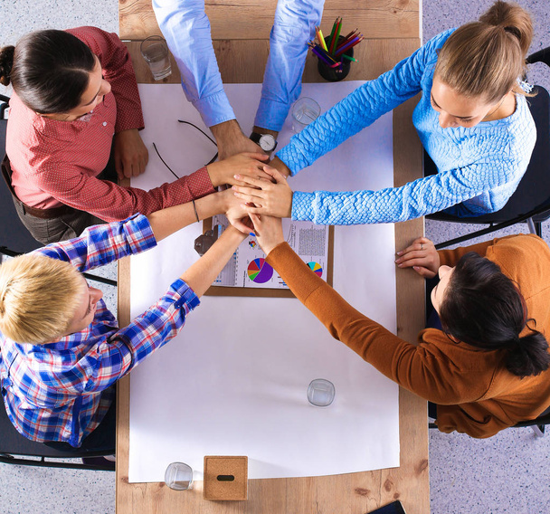 Business team with hands together - teamwork concepts - 写真・画像