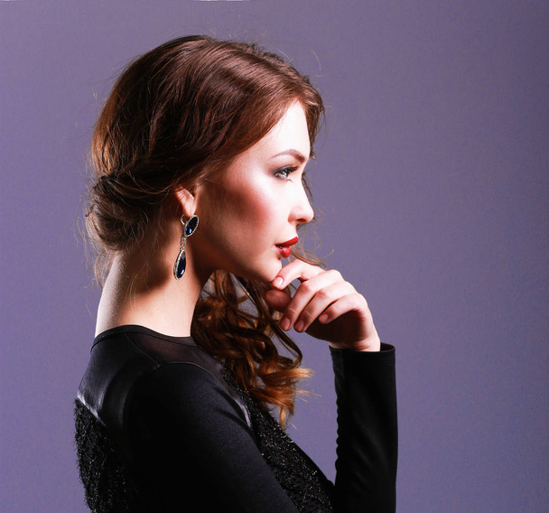 Portrait of beautiful brunette woman in black dress - Foto, Imagem