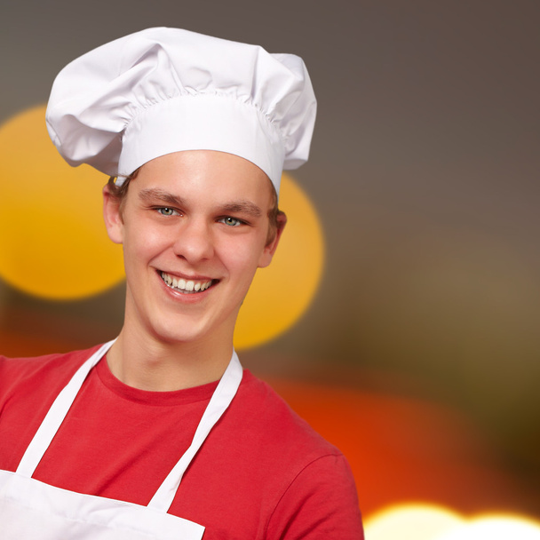 молодий кухар тримає цифровий планшет
 - Фото, зображення