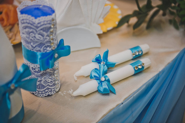 Two candles decorated with blue ribbons 733. - Φωτογραφία, εικόνα