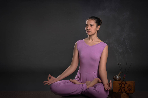 Young calm beautiful woman of the brunette on yoga pose - Zdjęcie, obraz
