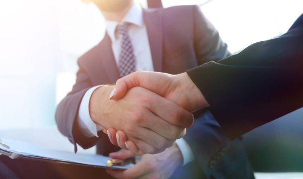 Close-up of two business people shaking hands - Photo, Image