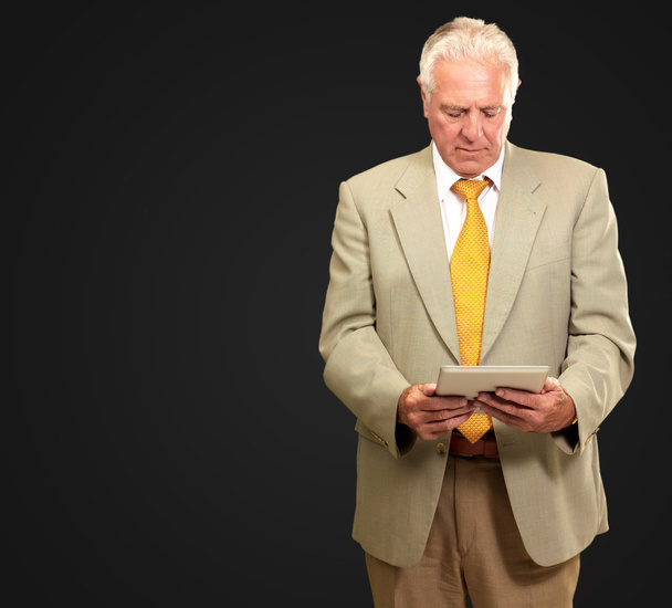 Portrait Of A Senior Man Working On A Laptop - Fotó, kép