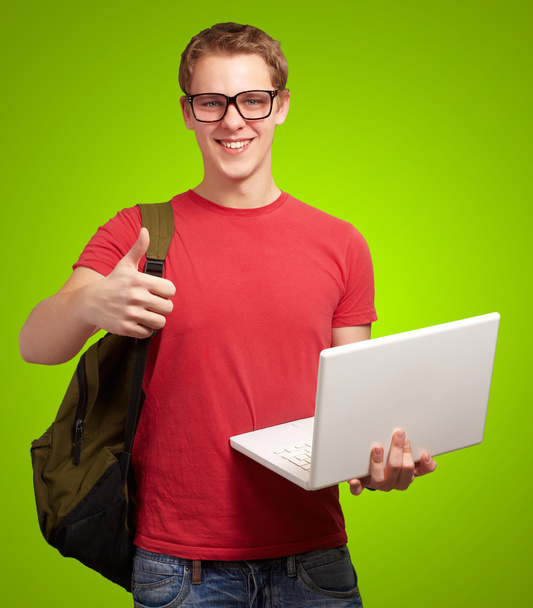 man holding laptop and backpack - Photo, Image