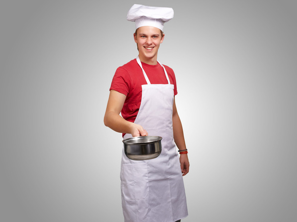 Portrait Of A Chef Holding Pan - Foto, afbeelding
