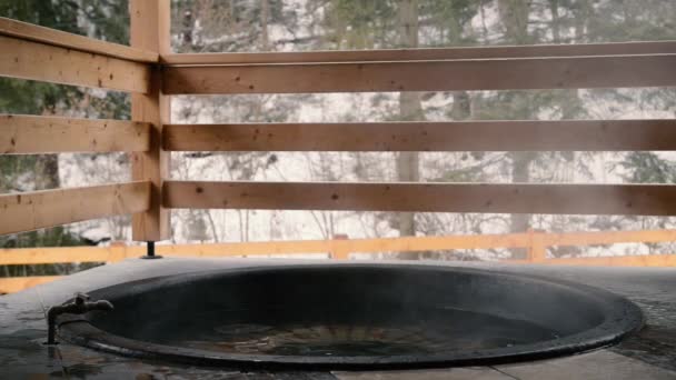 The cast iron vat with mineral water and turned off the tap with cold water. - Footage, Video
