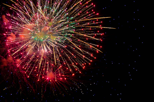 Colorful fireworks on dark sky - Fotó, kép