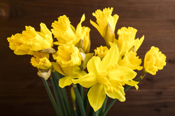 Bouquet Yellow daffodil on a wooden background. Copy space 1 - Foto, Imagem