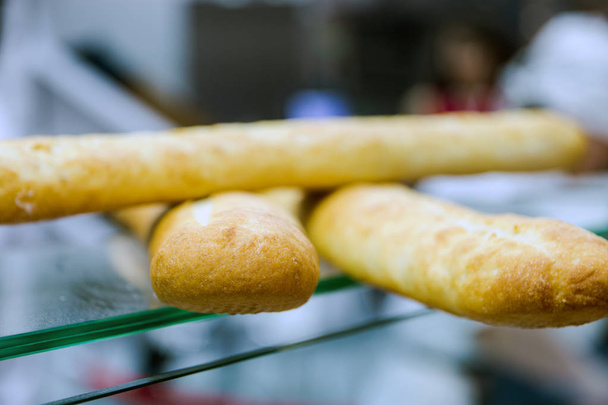 Bread baguettes in the baking shop close up - Foto, Imagem