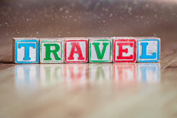 Toy letter blocks spelling the word travel - Photo, Image