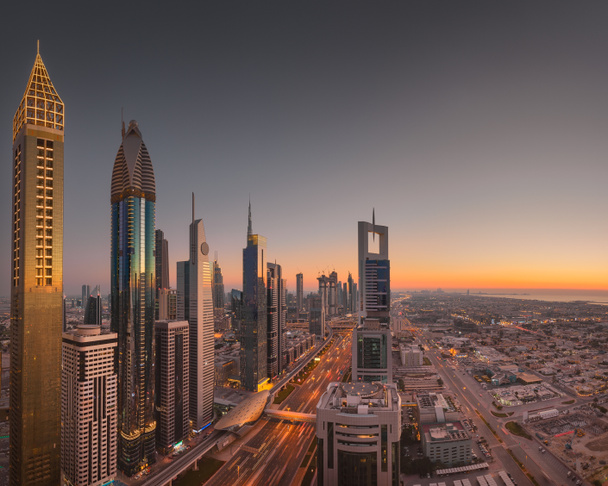 Dubai downtown skyline at beautiful golden sunset - Photo, Image