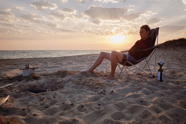 Man resting on sand beach.  - Valokuva, kuva
