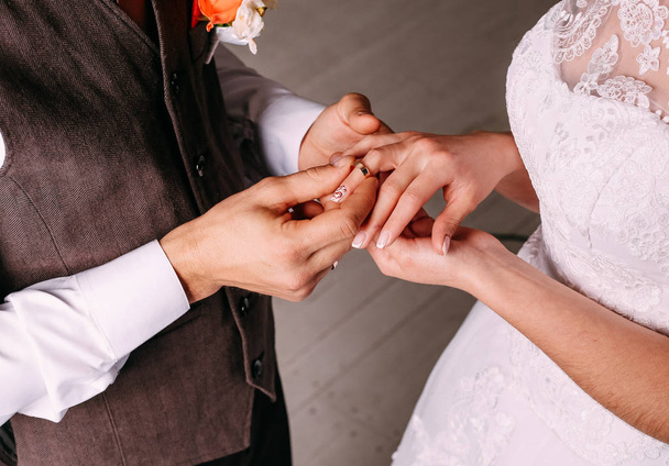 Wedding ceremony bride groom putting golden rings - 写真・画像