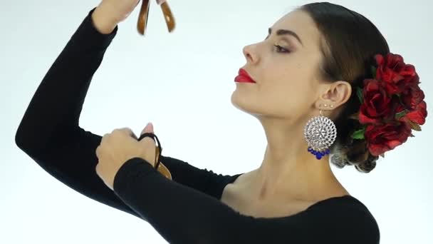 Close-up flamenco dancer on a light background. slow motion - Felvétel, videó