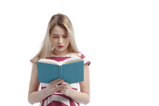 young girl with book isolated on a white background - Photo, Image
