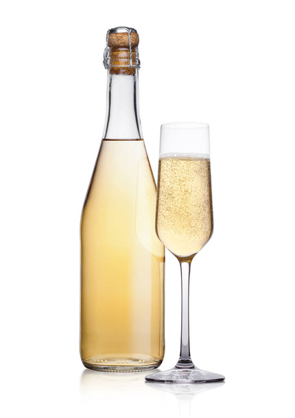Bottle and glass of yellow champagne with bubbles - Fotoğraf, Görsel