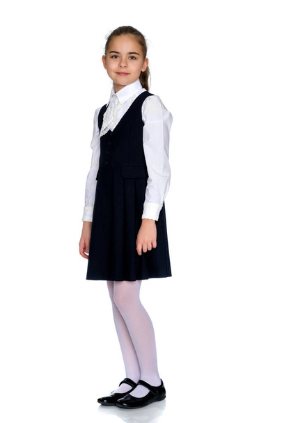 Beautiful little girl in a school uniform. - Foto, Imagem