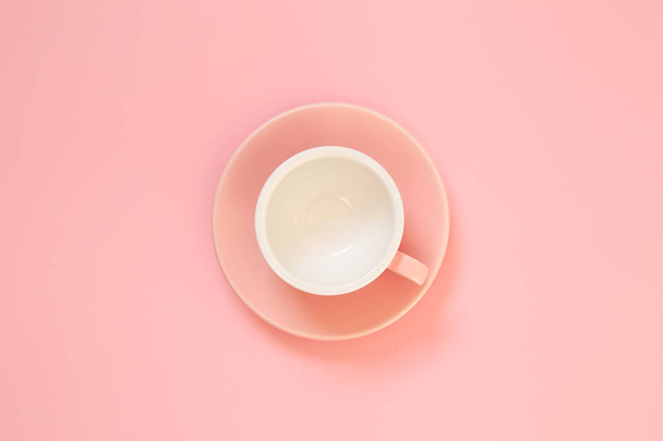 Pink coffee cup on pink background - Valokuva, kuva