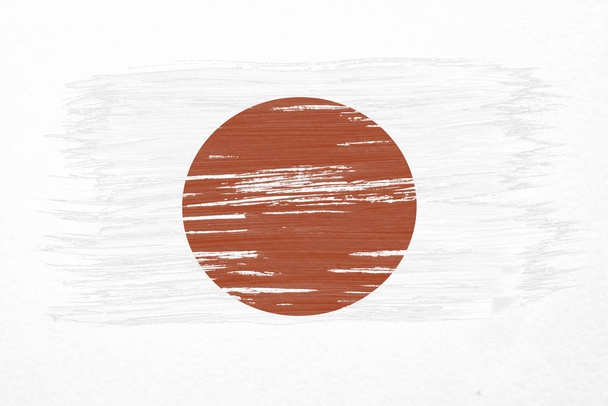 Art brush watercolor painting of Japan flag blown in the wind isolated on white background. - Photo, Image