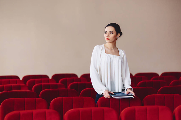 woman looks aside of seats between armchairs - Valokuva, kuva