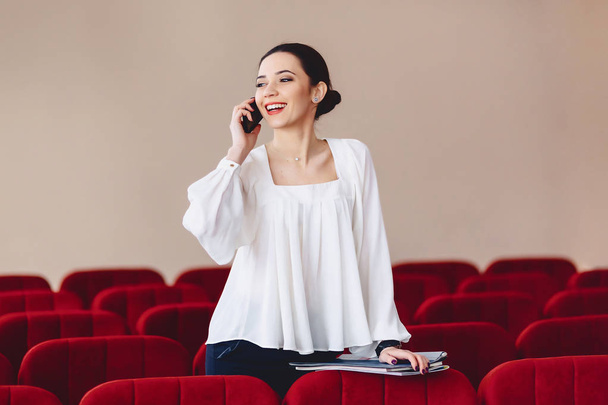 smiling woman is talking fun over phone - Photo, Image