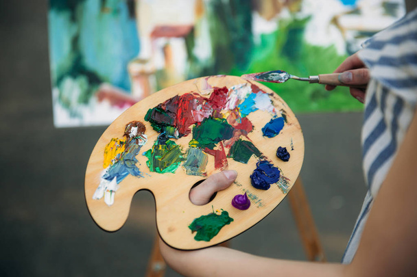 Palette with paints and spatula - Photo, Image