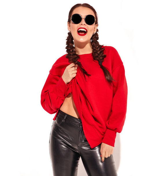 Portrait of young happy smiling woman model with bright makeup and colorful lips with two horns and sunglasses in summer red clothes isolated on white. Going crazy - Fotó, kép