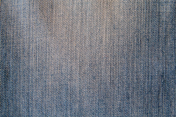 Ткань из голубой джинсы крупным планом. Фон и текстуры
 - Фото, изображение