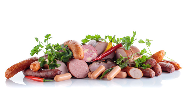Different sausages and smoked meats isolated on white . - Photo, Image