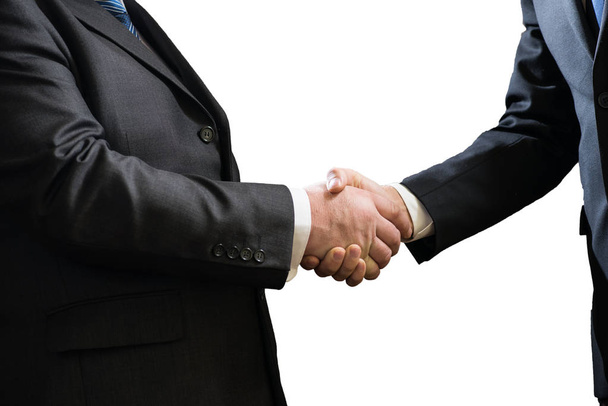 Business handshake of two businessmen in suits isolated on white background - Photo, image