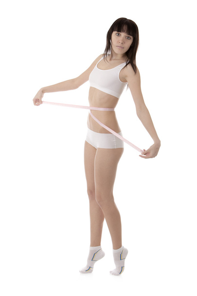 Girl measuring her waist - Foto, imagen