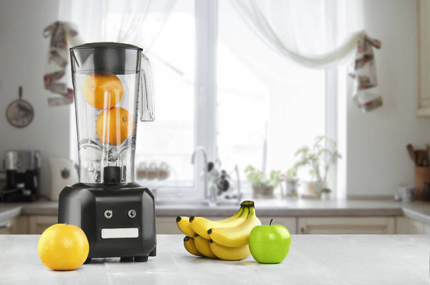 Blender, fruits and kitchen space - Photo, image
