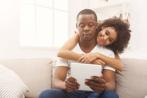 Black couple making using digital tablet at home - Valokuva, kuva