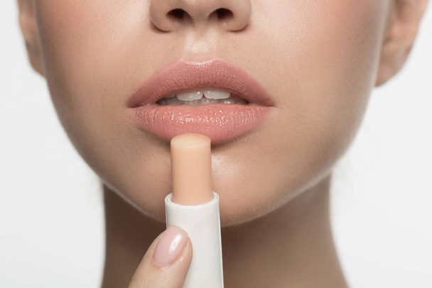 Sensual mouth of girl who is using hypoallergenic lipstick - Φωτογραφία, εικόνα